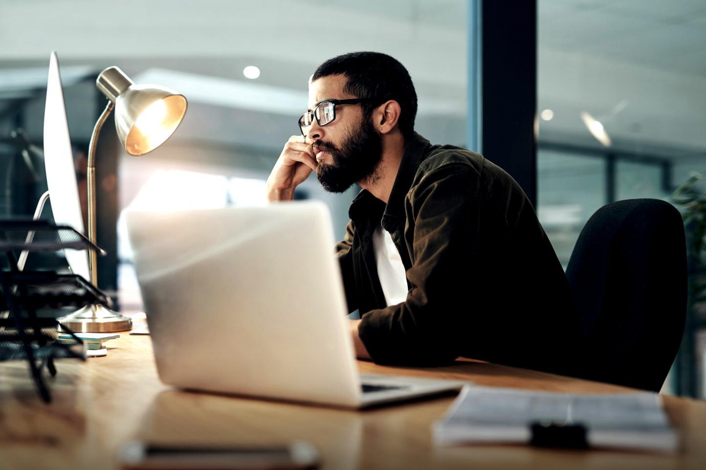 Financial reporting documents and investor analysis materials spread on a desk