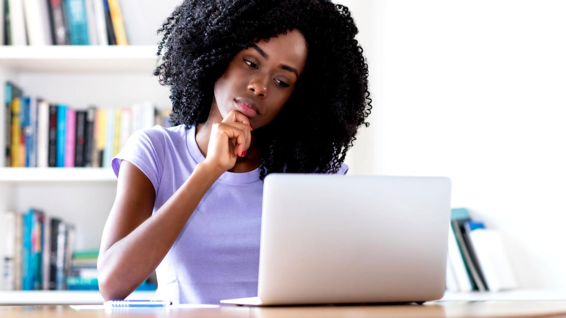 Student working through financial quiz on screen